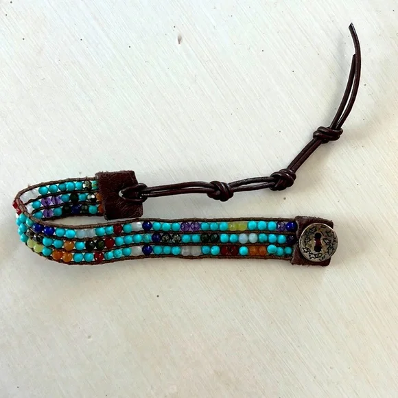 Multicolored gemstone leather wrap bracelet.